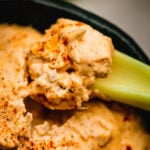 Super Easy Buffalo Chicken Dip with cooked chicken, spicy sauce and cheese. Perfect appetizer for game day or any holiday.