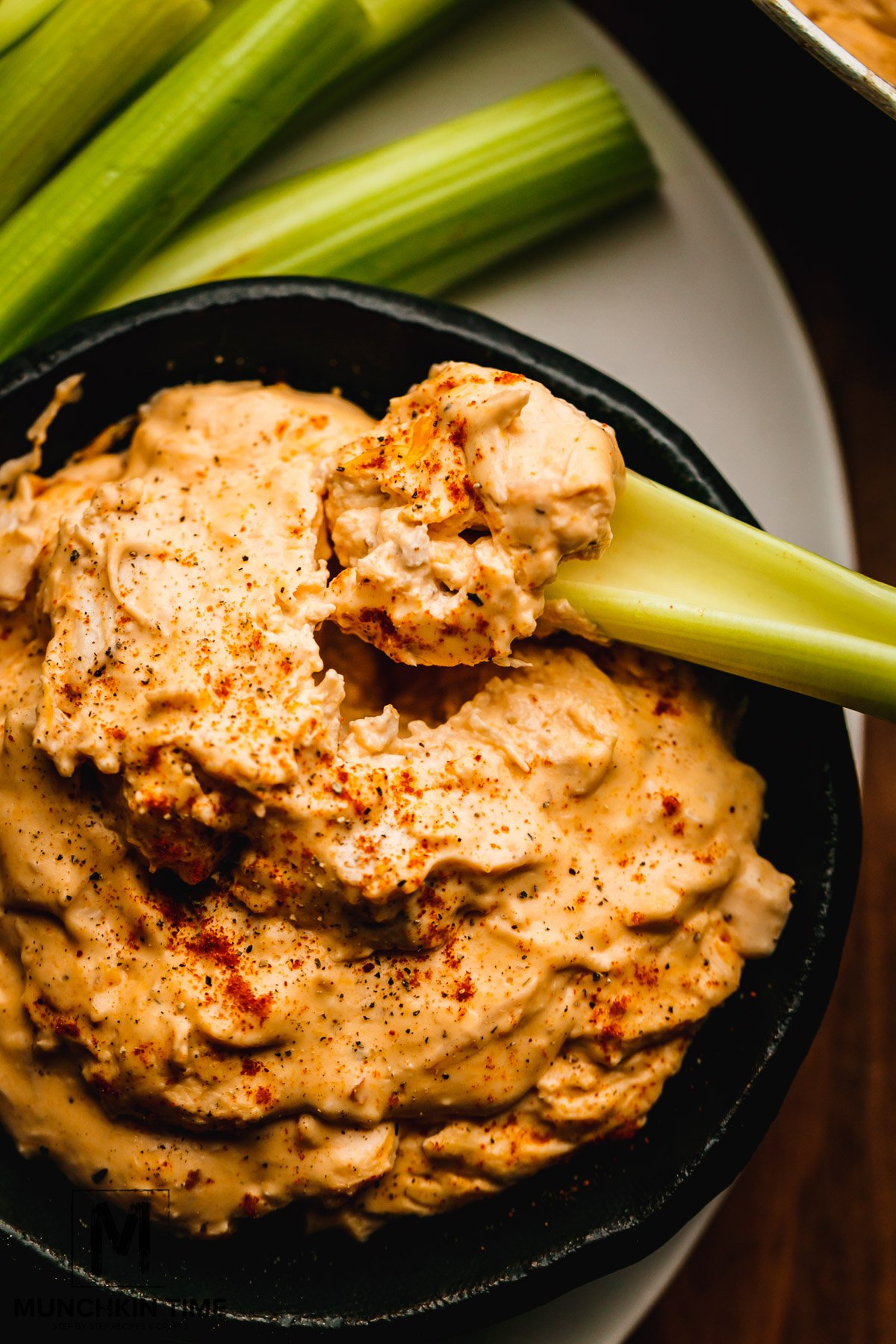 Super Easy Buffalo Chicken Dip with cooked chicken, spicy sauce and cheese. Perfect appetizer for game day or any holiday.