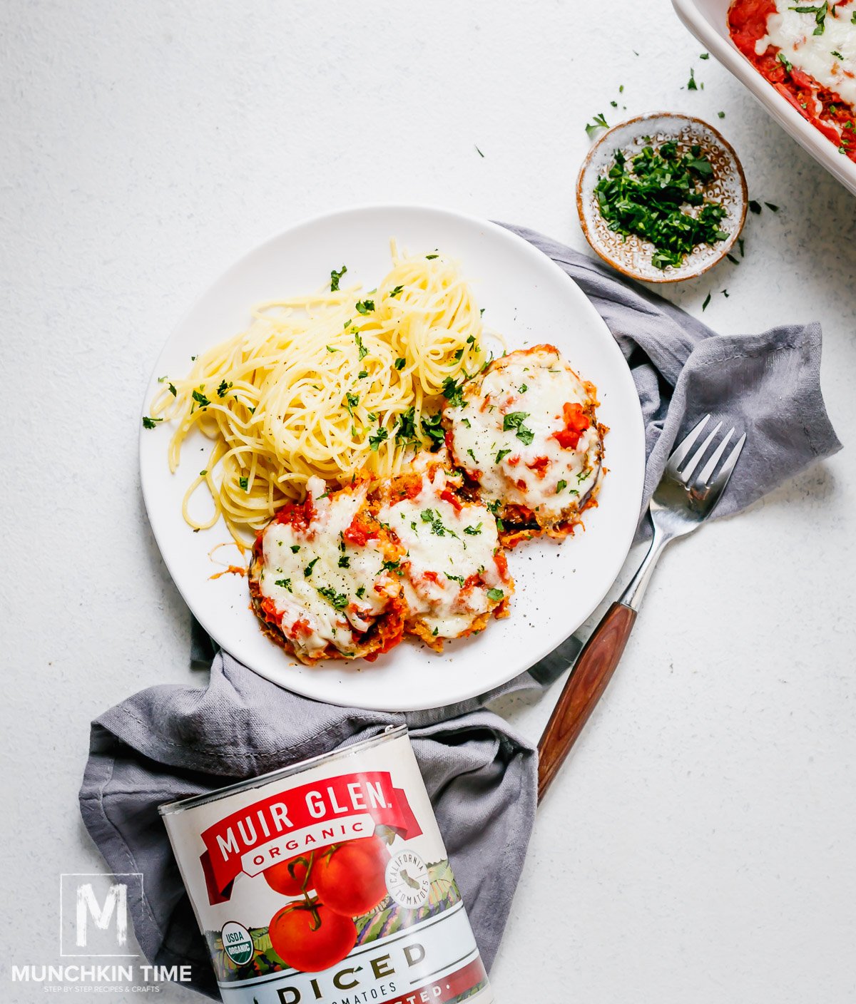 Easy Eggplant Parmesan baked in the oven & served with pasta.