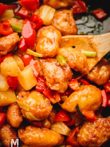 Sweet and Sour Chicken with Pineapple and Peppers is ready to be served.