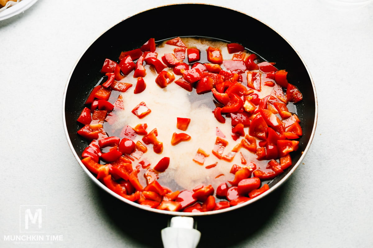 Sweet and sour sauce added to the skillet.
