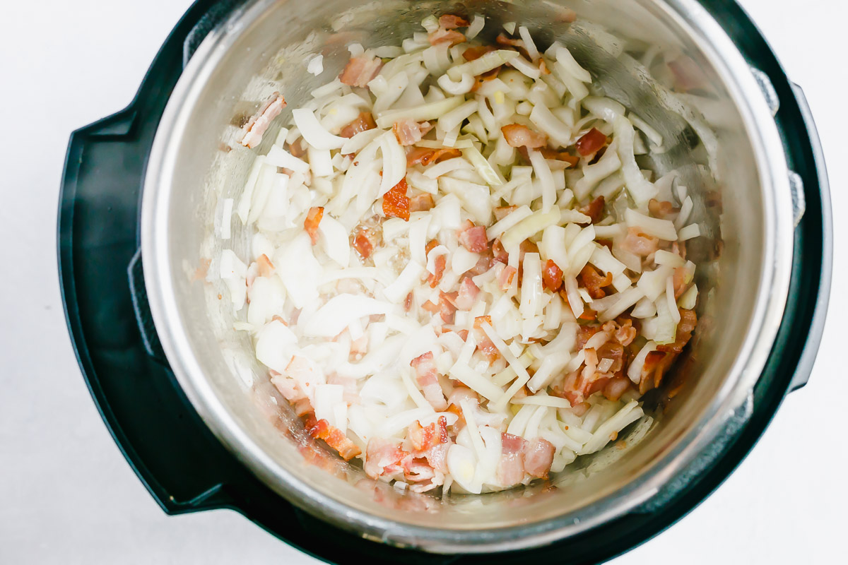 Saute Bacon with onion inside Instant Pot.