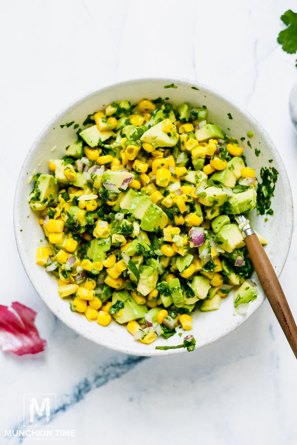 mixed avocado corn salsa in a bowl.