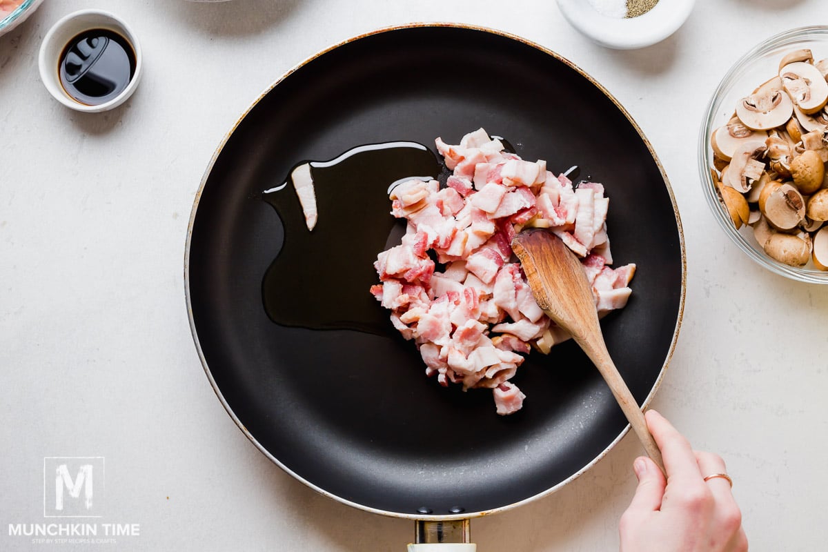 Bacon and oil inside the skillet.