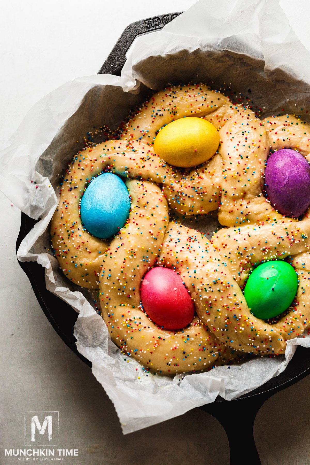 Place the braided easter dough into a greased baking dish or parchment paper lined over a cast iron.