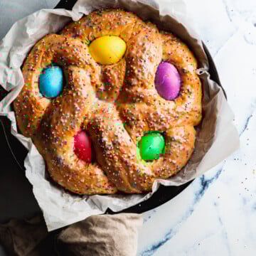 Preheat oven to 350 degrees F (175 degrees C). Place loaf on a buttered baking sheet and cover loosely with a damp towel. Place loaf in a warm place and let rise until doubled in bulk, about 45 minutes. Brush risen loaf with melted butter.