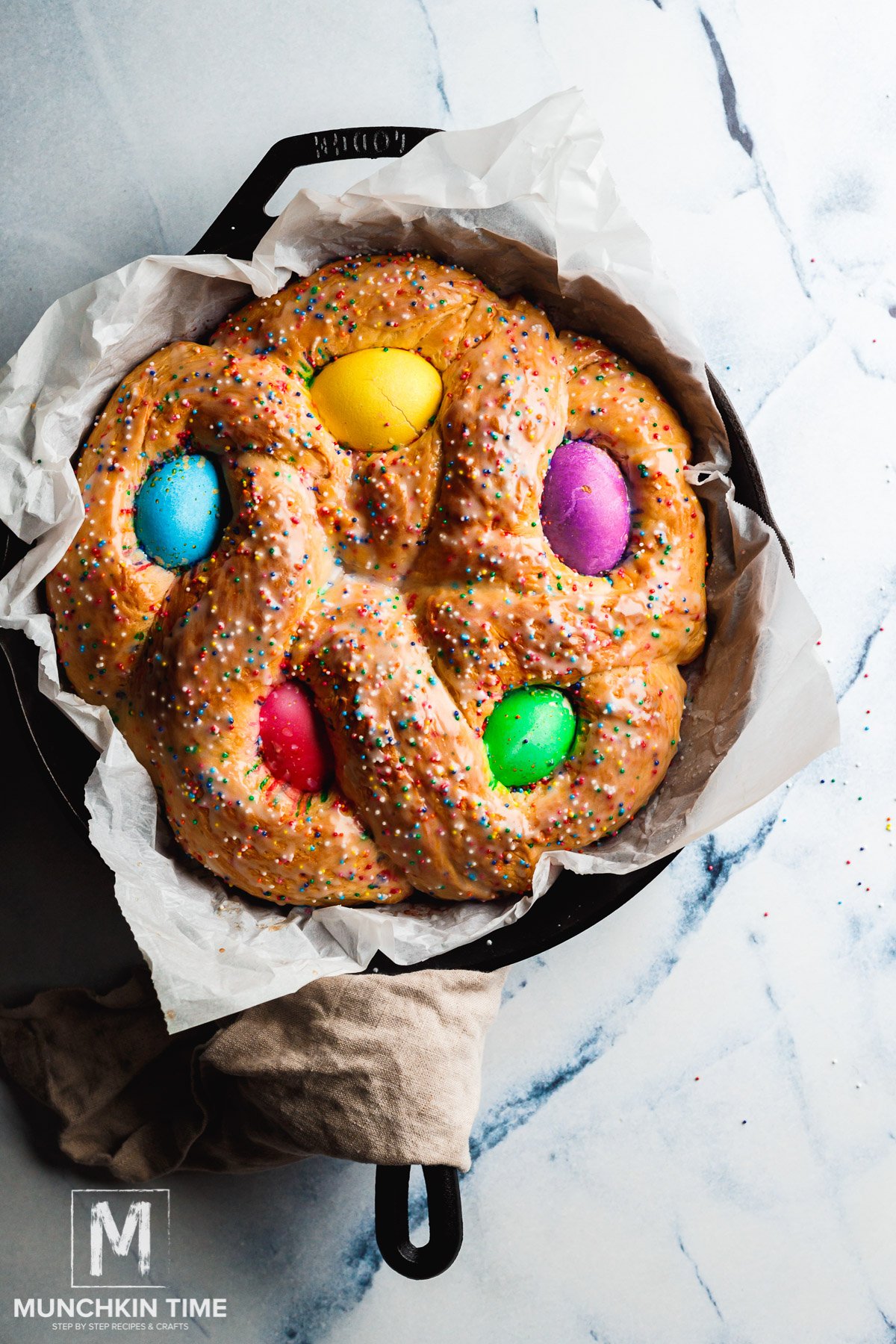 Preheat oven to 350 degrees F (175 degrees C). Place loaf on a buttered baking sheet and cover loosely with a damp towel. Place loaf in a warm place and let rise until doubled in bulk, about 45 minutes. Brush risen loaf with melted butter.