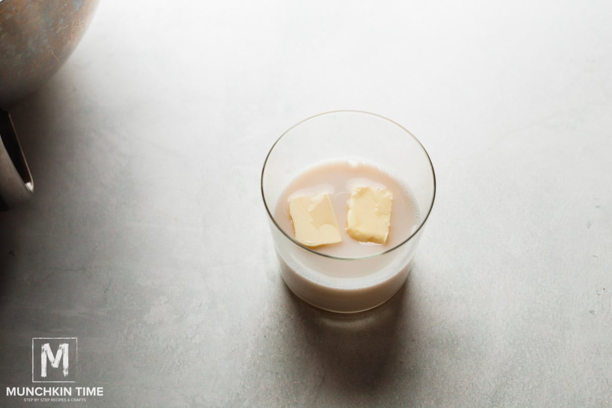 Butter and milk added to the glass.