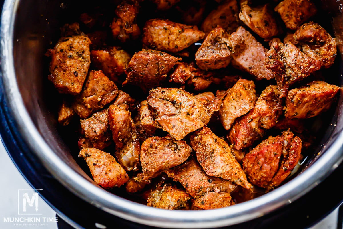 Roasted pork shoulder added to the instant pot.