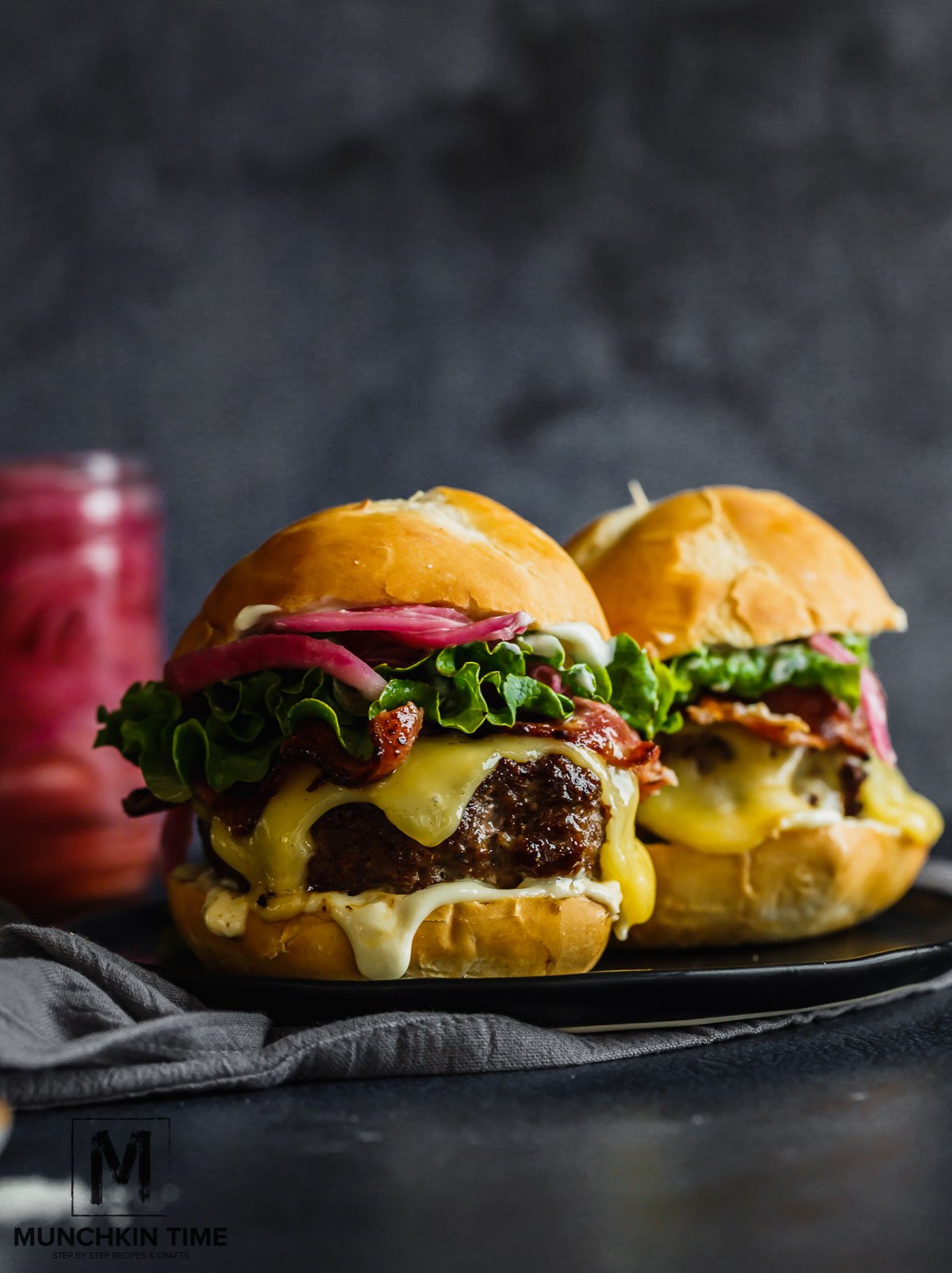 Homemade Burger Recipe with Pickled Red Onions with ground beef & ground pork, cheese, lettuce and pickled red onions.