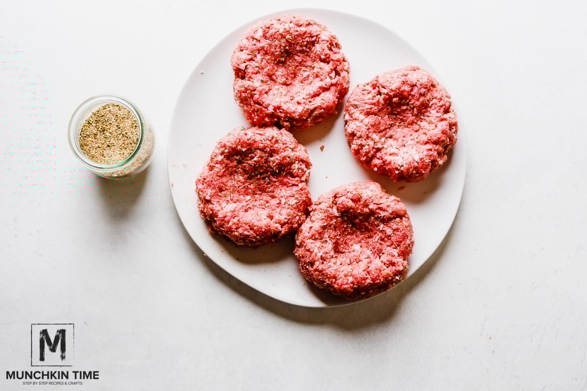 Homemade Burger Recipe with ground beef & ground pork, cheese, lettuce and pickled red onions.