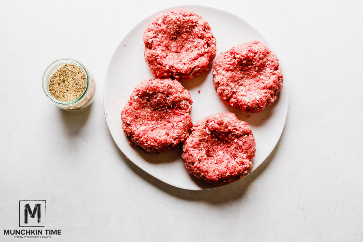 Homemade Burger Recipe with ground beef & ground pork, cheese, lettuce and pickled red onions.