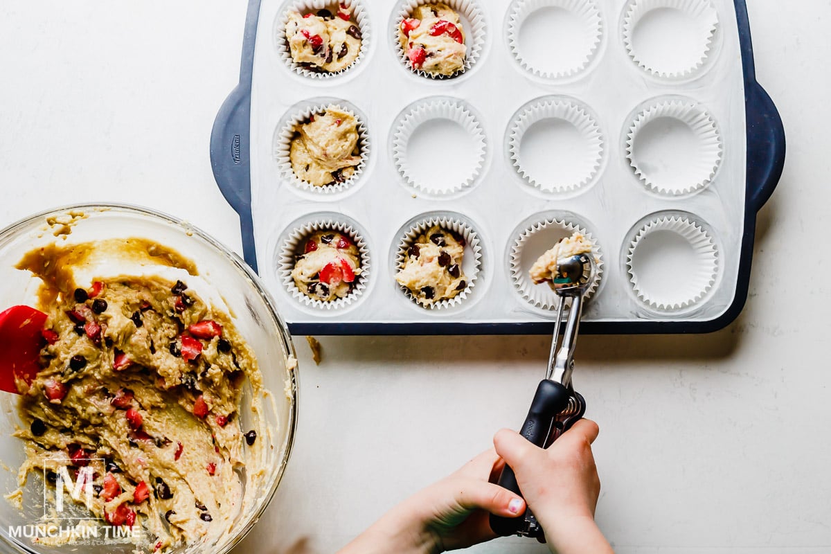 Scoop muffin batter into muffin tin.