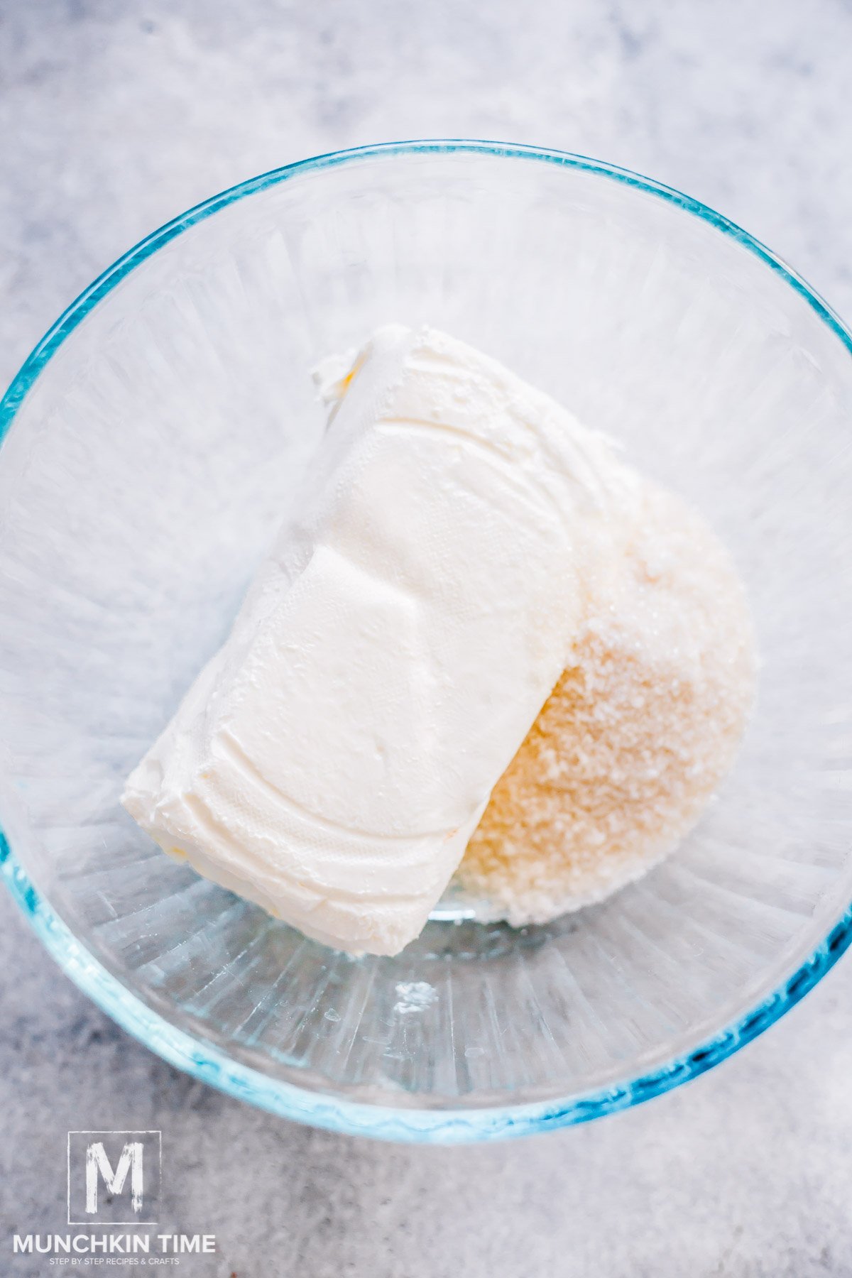 cream cheese and sugar in a bowl.