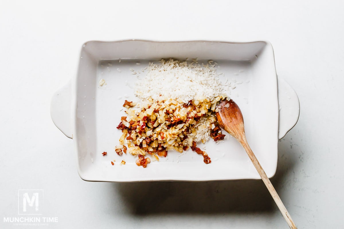 Saute onion with bacon inside the casserole dish with rice.