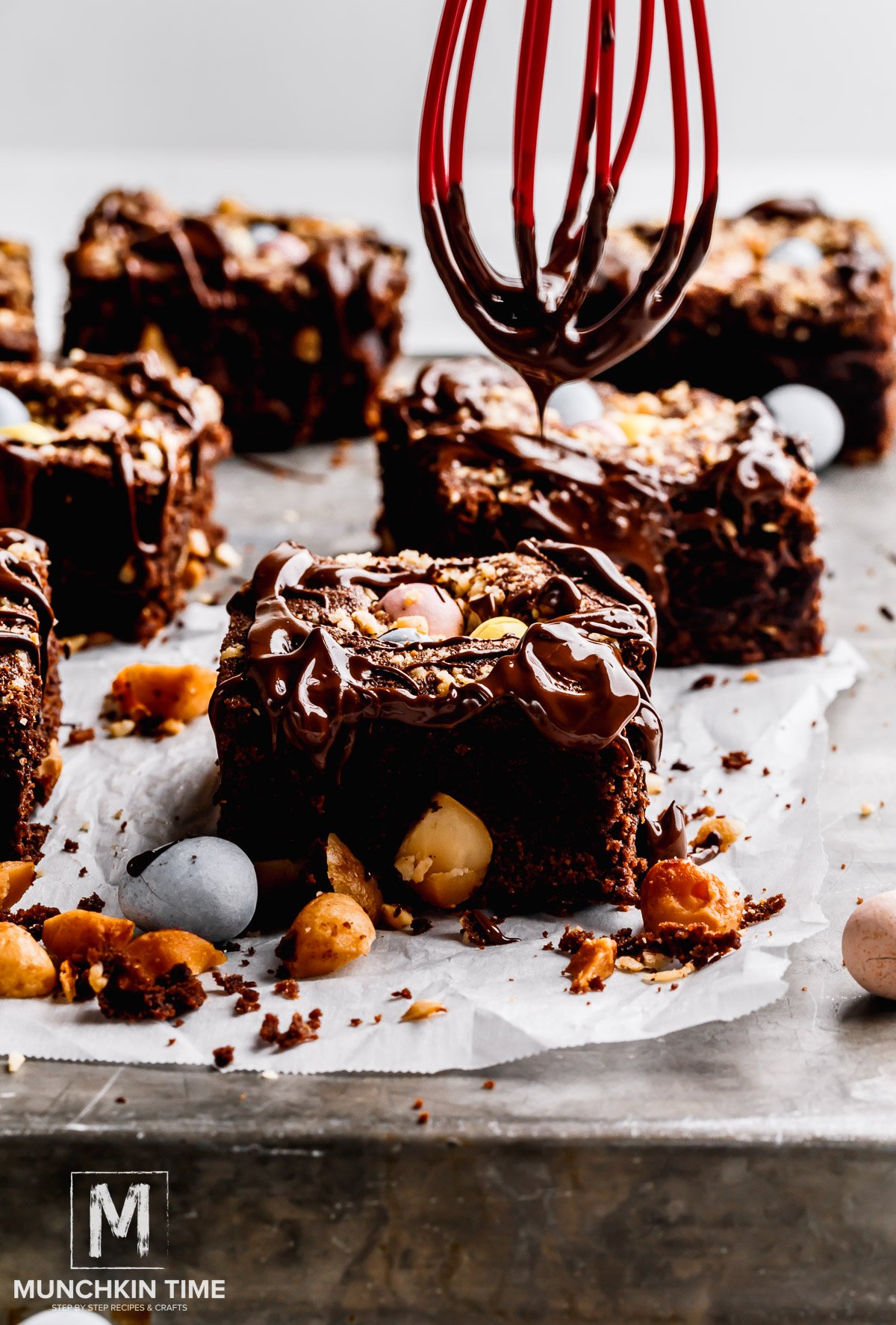 Melted chocolate glazed over chocolate brownies.