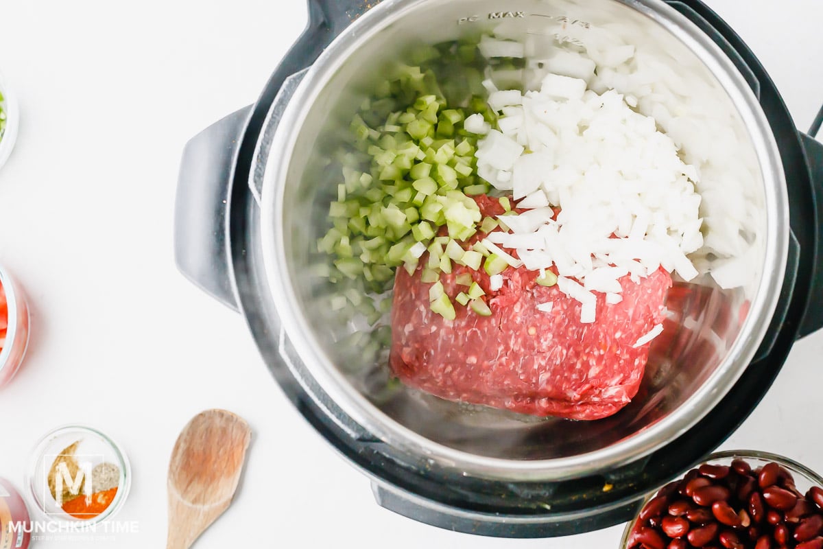 Add beef, celery and onion to instant pot.