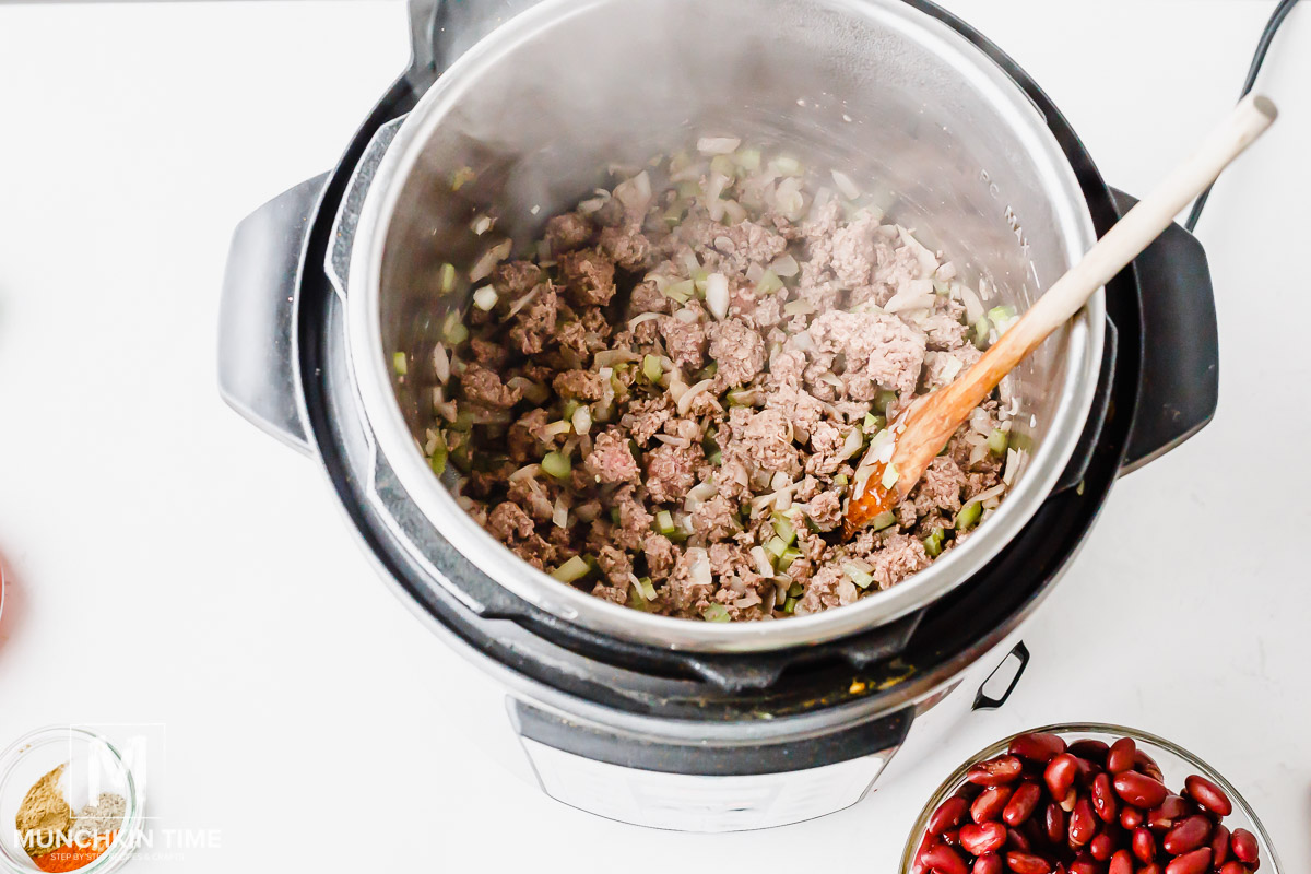 Saute ground beef, celery and onion inside instant pot. 