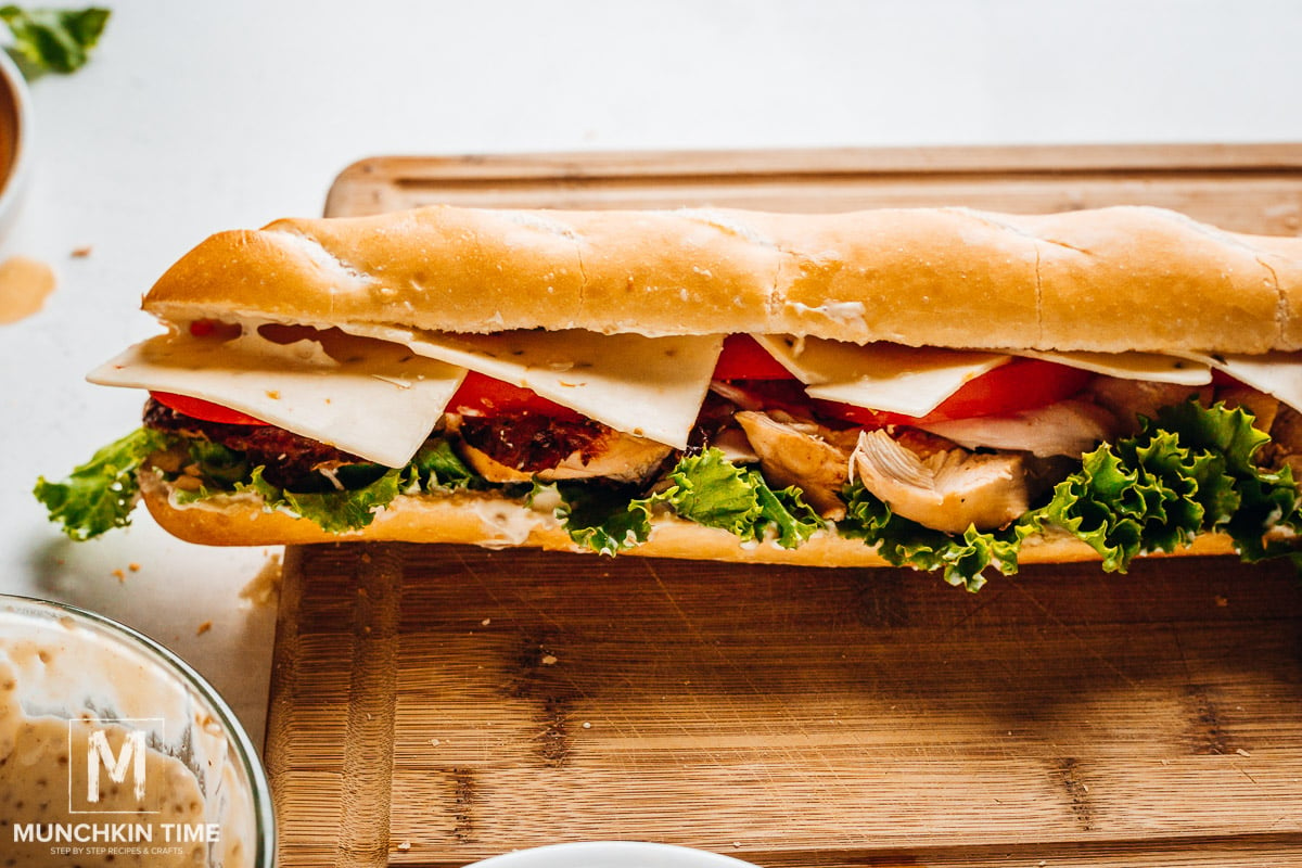 Sliced tomato and sliced cheese added to the sandwich.