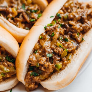 Beef sandwich served with mushroom soup.