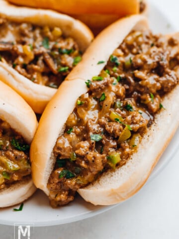 Beef sandwich served with mushroom soup.