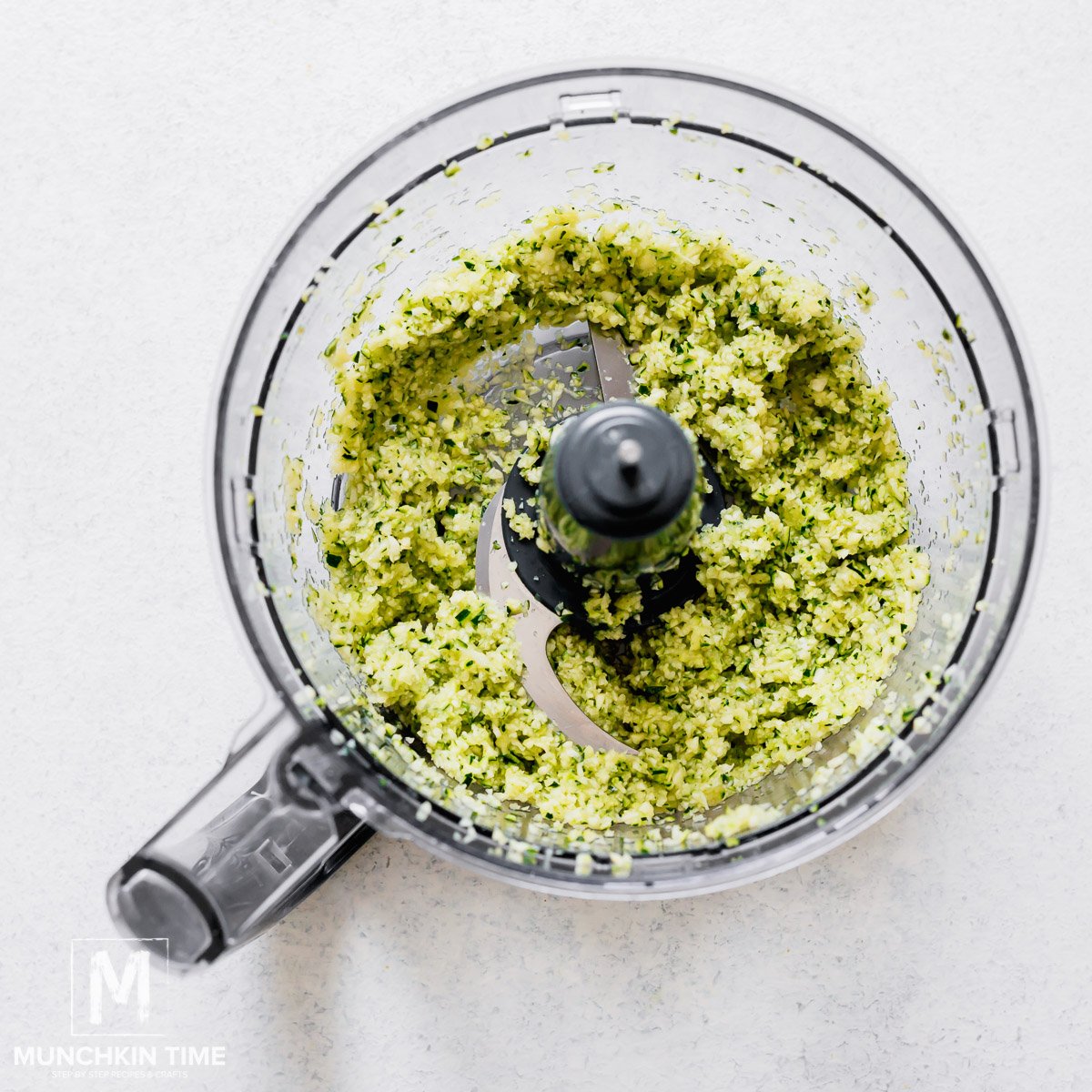 Zucchini mixture in a food processor.