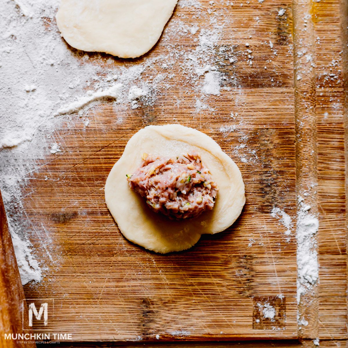 Filling in the center of the dough.