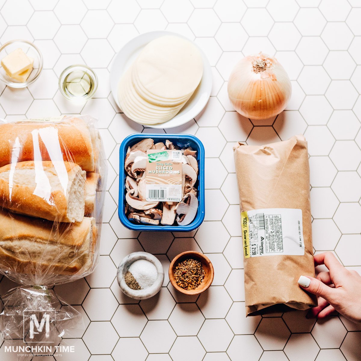 Ingredients to make homemade philly cheesesteak sandwich