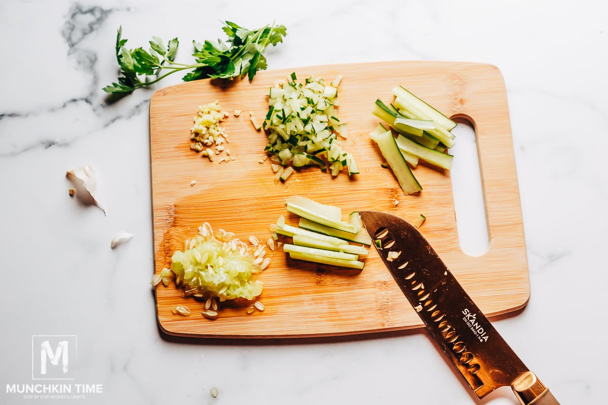 Cut cucumber and garlic.