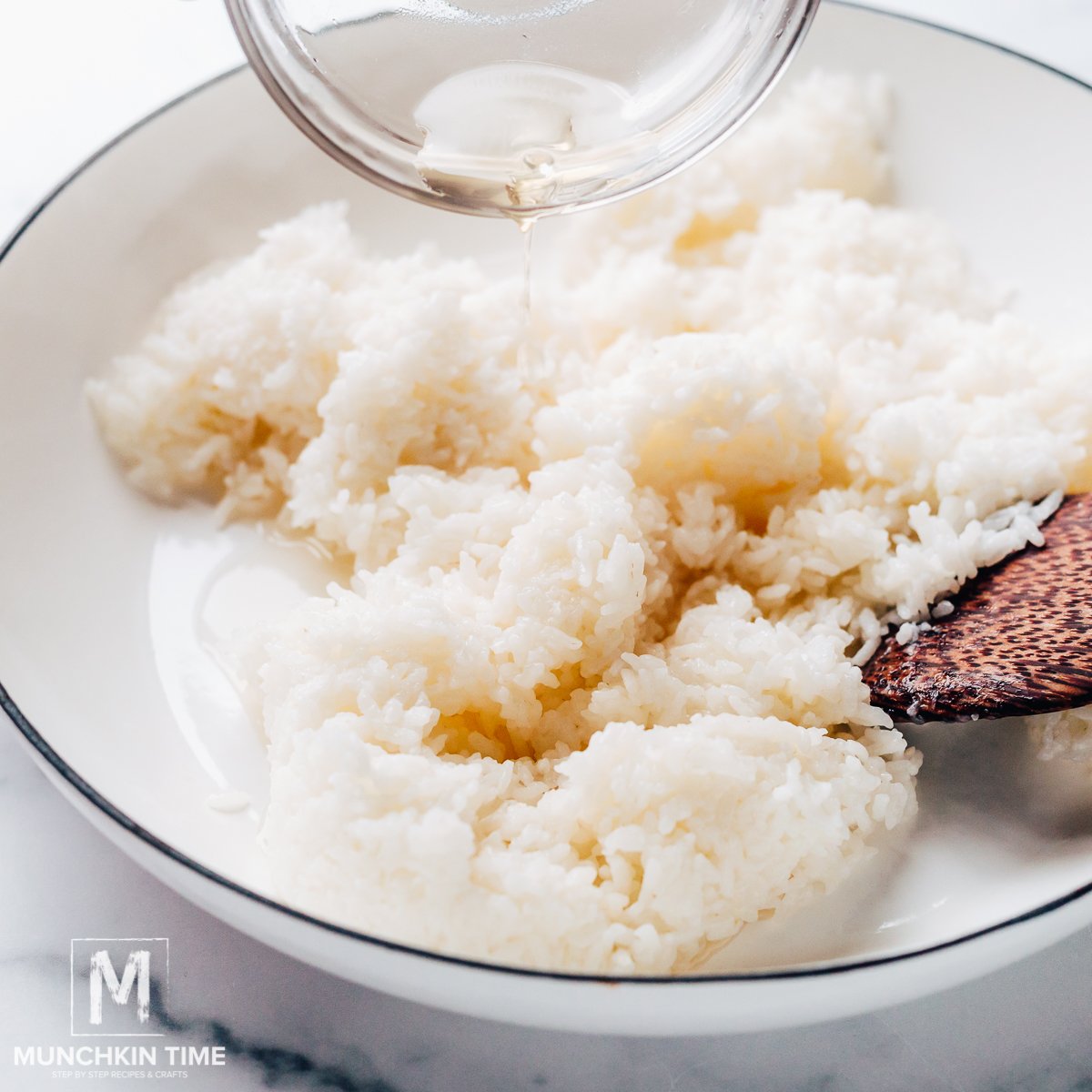 Pour the vinegar mixture all over the rice to season