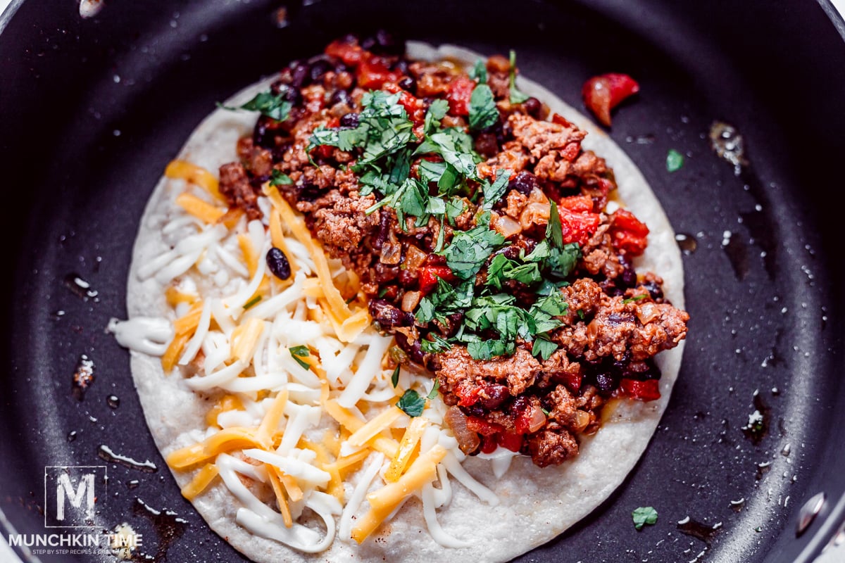 Assembling the quesadillas