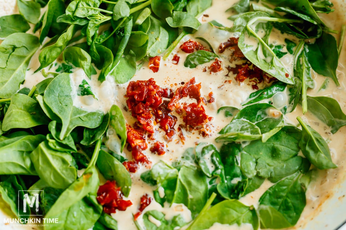 spinach and sun dried tomatoes added to the skillet