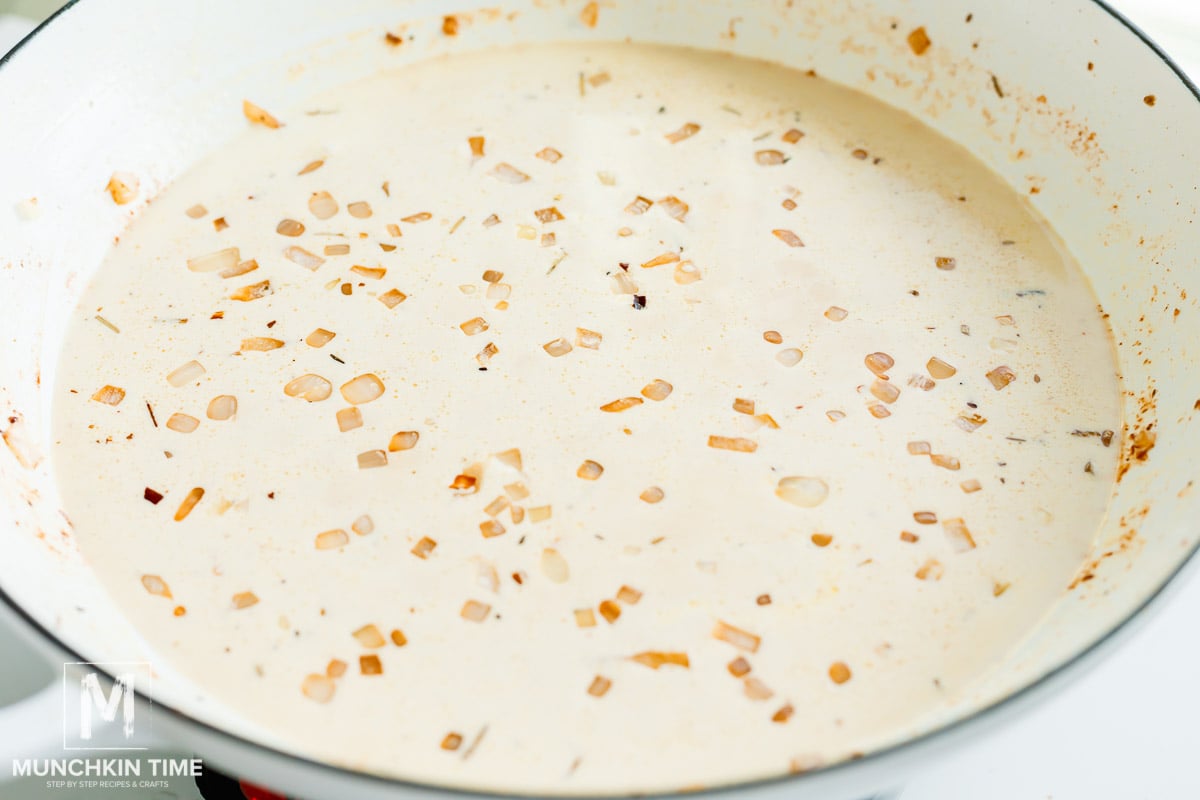 heavy whipping cream added to the skillet with onion