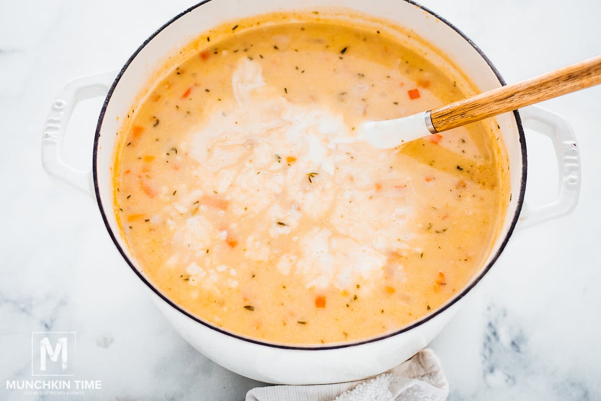 Adding cream to the soup