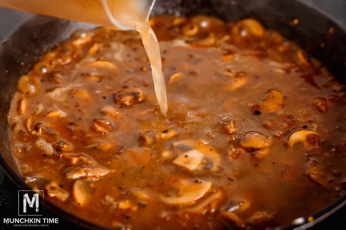 adding beef broth to the Caramelized Onion with mushrooms and seasoning