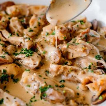 Creamy sauce pouring over Chicken Mushroom Recipe