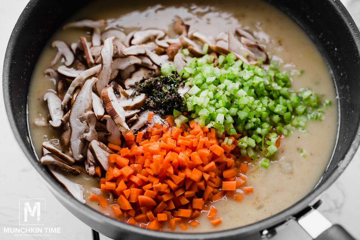Carrot, mushrooms and celery added to the skillet with the sauce.