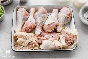 Pat dry the chicken thighs and drumsticks with a paper towel.