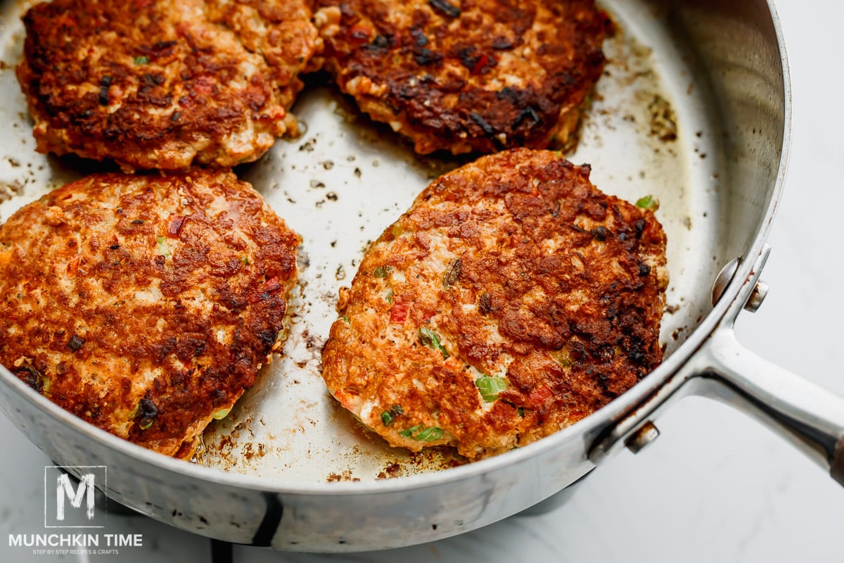 cooking chicken patties in the skillet