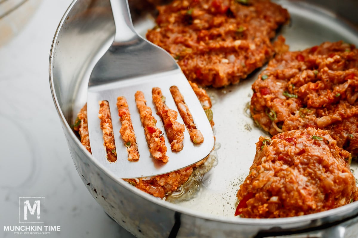 cooking chicken patties in the skillet