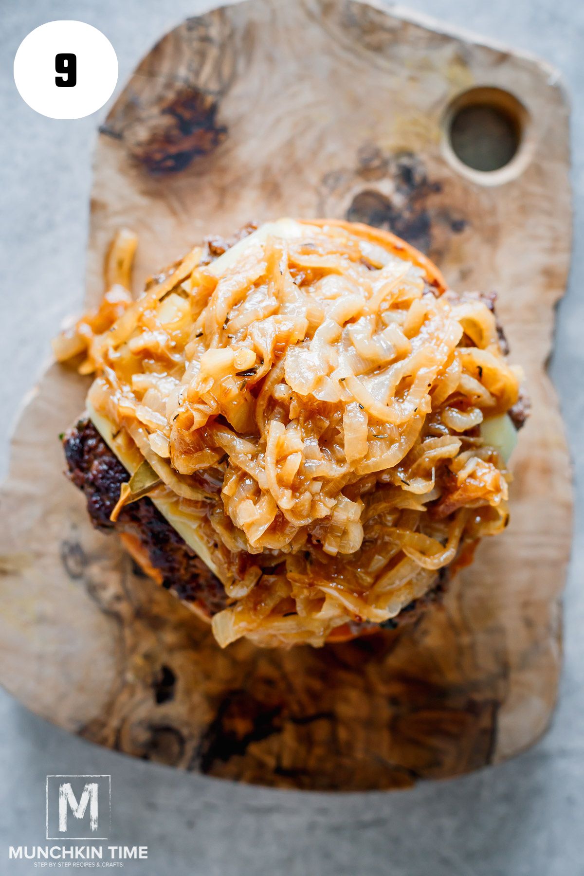 caramelized onions added to the burger with melted cheese.