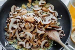 mushrooms cooking in the skilelt