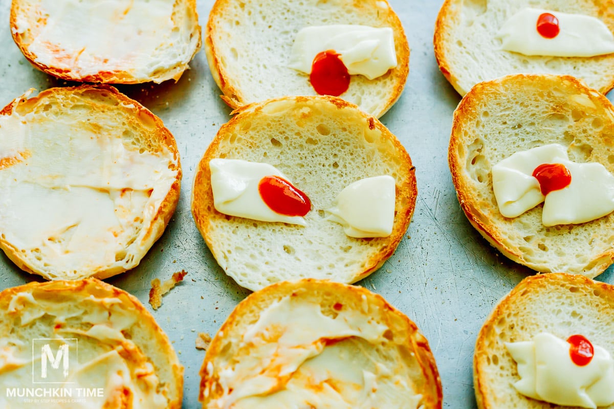 toasted english muffins with mayo and hot sauce