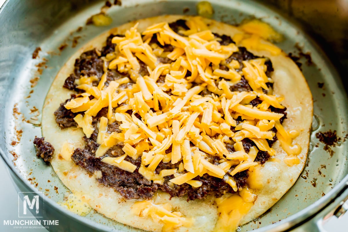 cooked tortilla with beef and cheese