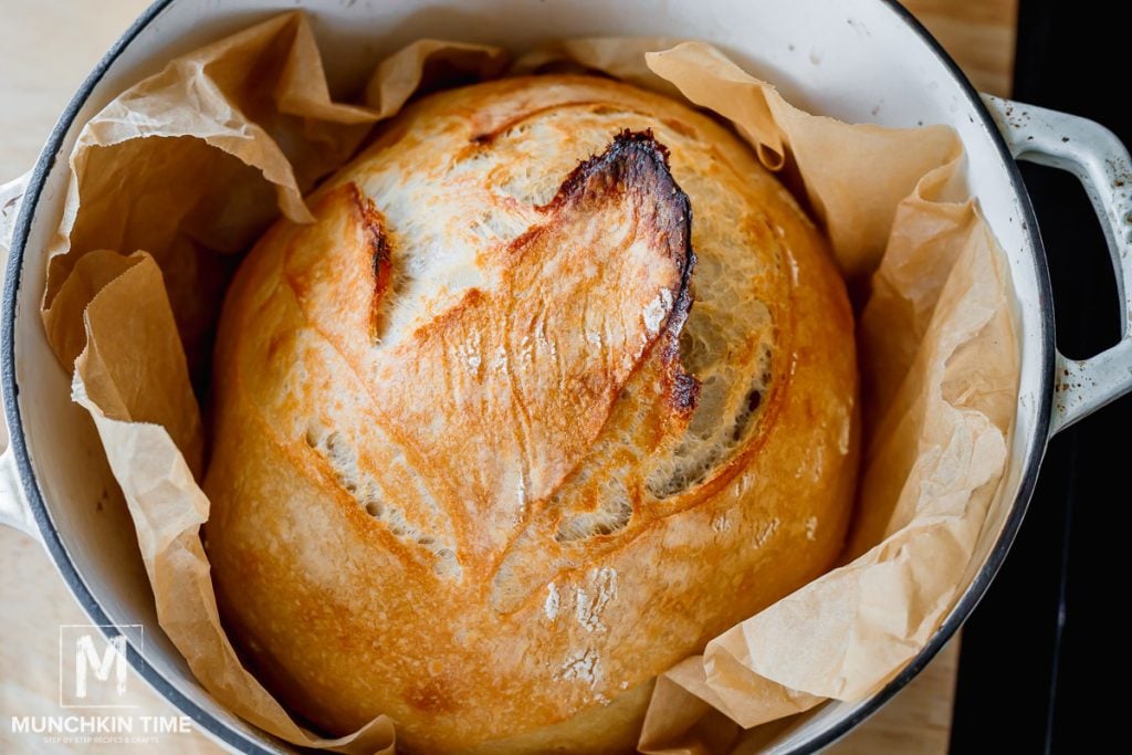 baked sourdough bread inside the dutch oven