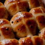 Hot Cross Buns freshly baked and glazed with sugar glaze.