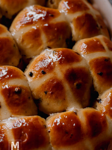 Hot Cross Buns freshly baked and glazed with sugar glaze.