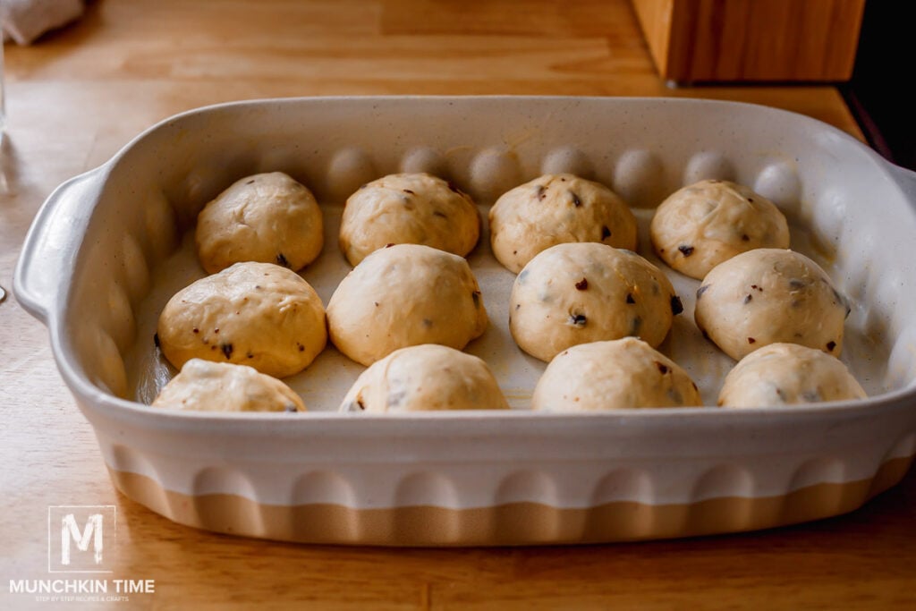 dough balls placed in a baking dish.