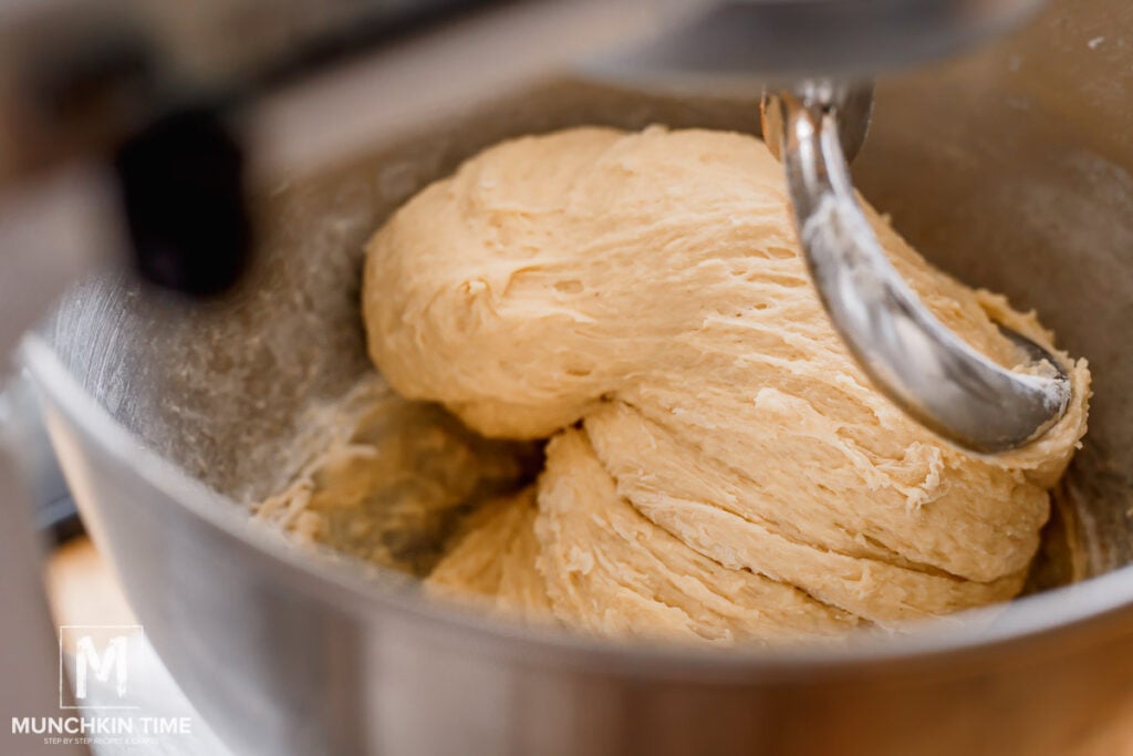 dough for buns is formed inside the stand mixing bowl.