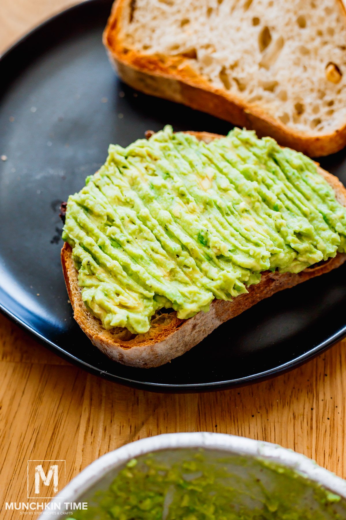 sliced bread with avocado spread evenly over the top